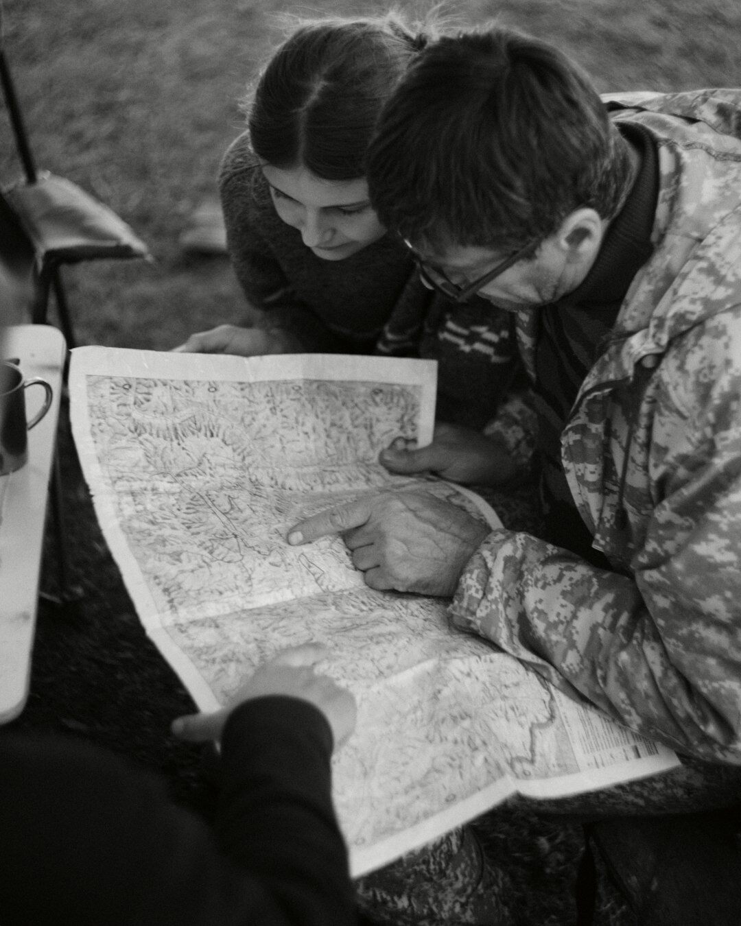 Two colleagues reviewing a strategic plan together at a desk