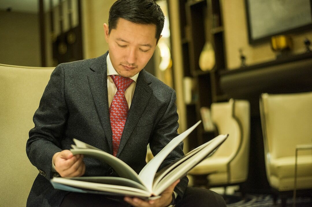 Business analyst studying market reports at a desk